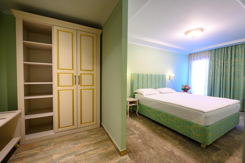 Postel nebo postele na pokoji v ubytování Hotel Iris-Mimoza