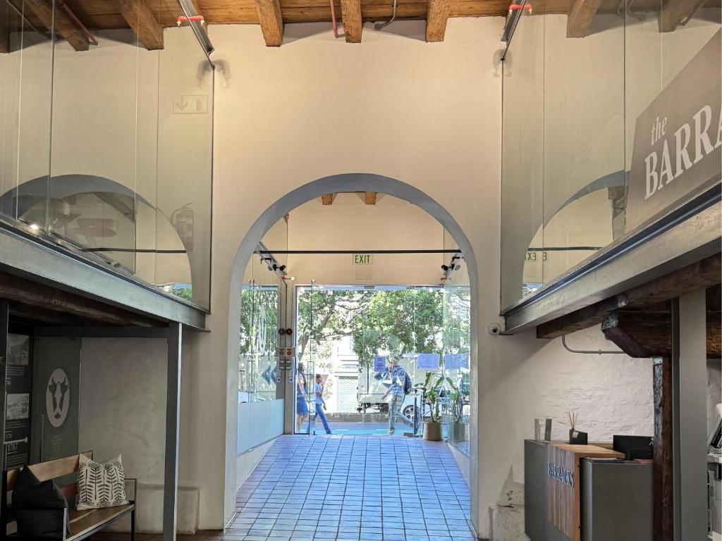 an entrance to a building with an archway at Bree Street Apartment - Explore, Eat, Experience Cape Town in Cape Town