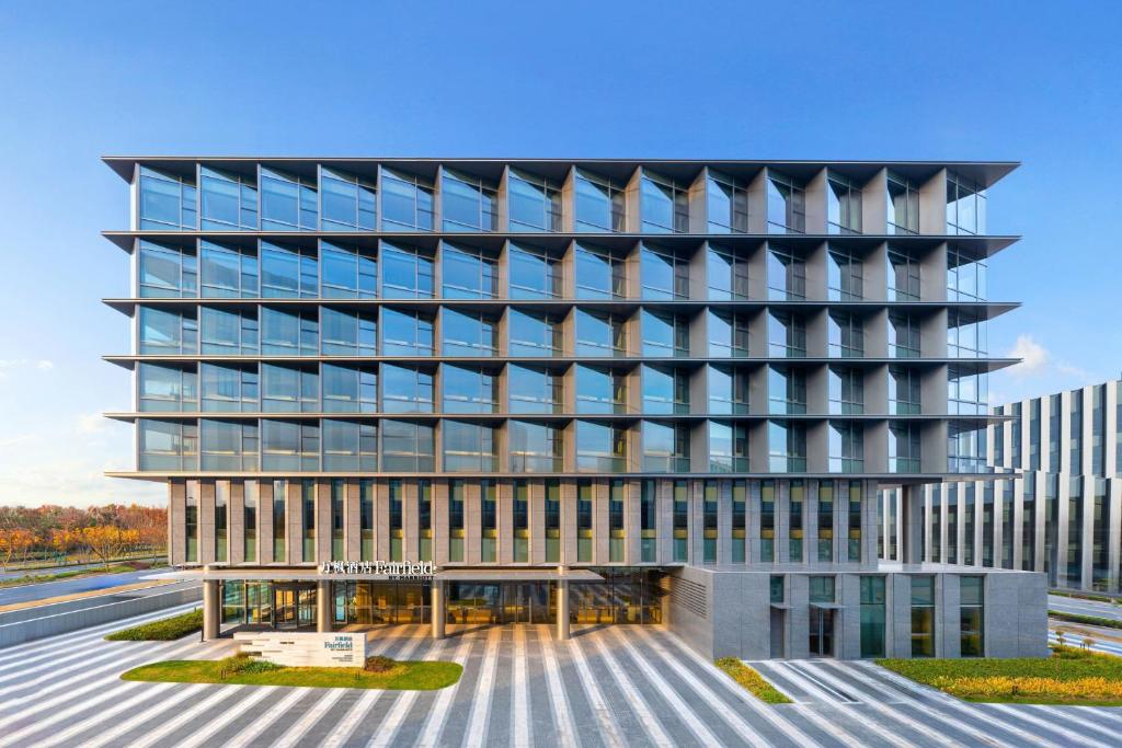 a rendering of a building with a lot of windows at Fairfield by Marriott Shanghai Lingang Special Area in Shanghai