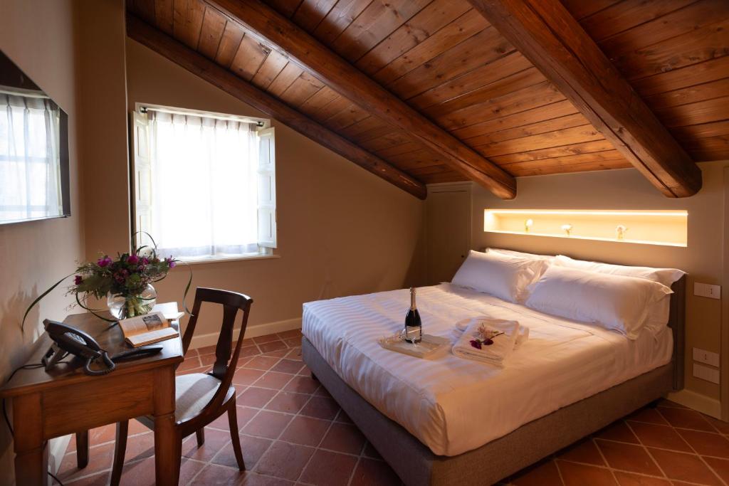 Postel nebo postele na pokoji v ubytování Agrisuite Le Querce del Vareglio