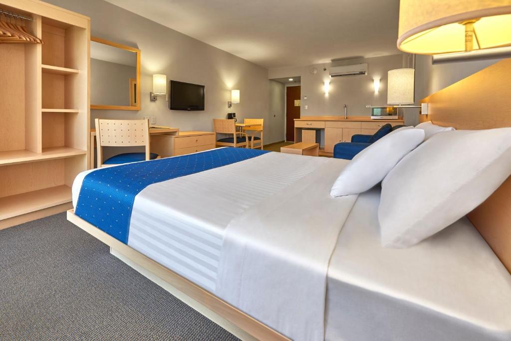 Cama o camas de una habitación en City Express by Marriott Puebla FINSA