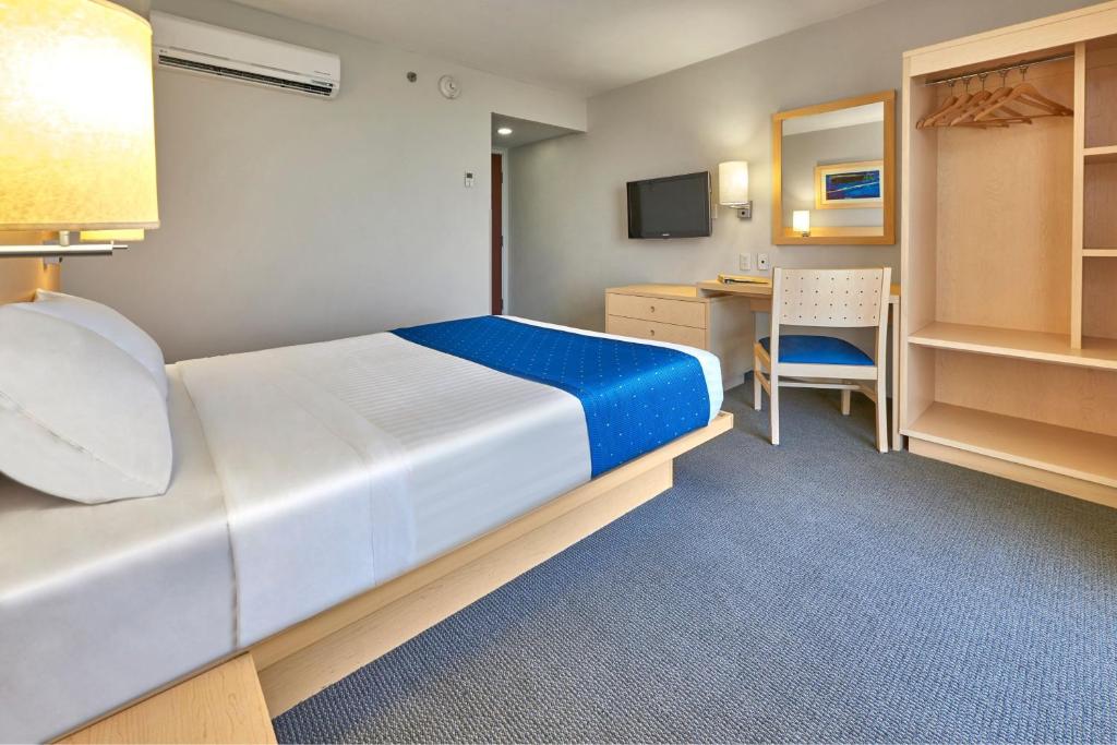 Cama o camas de una habitación en City Express by Marriott Puebla FINSA
