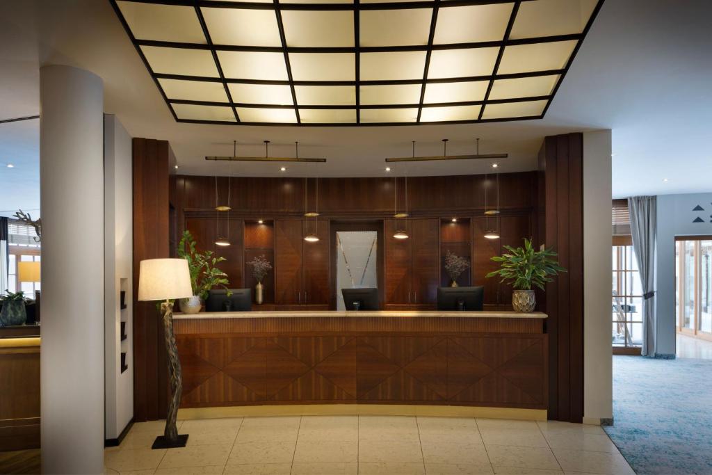 a lobby with a waiting area with a waiting room at Arabella Jagdhof Resort am Fuschlsee, a Tribute Portfolio Hotel in Hof bei Salzburg