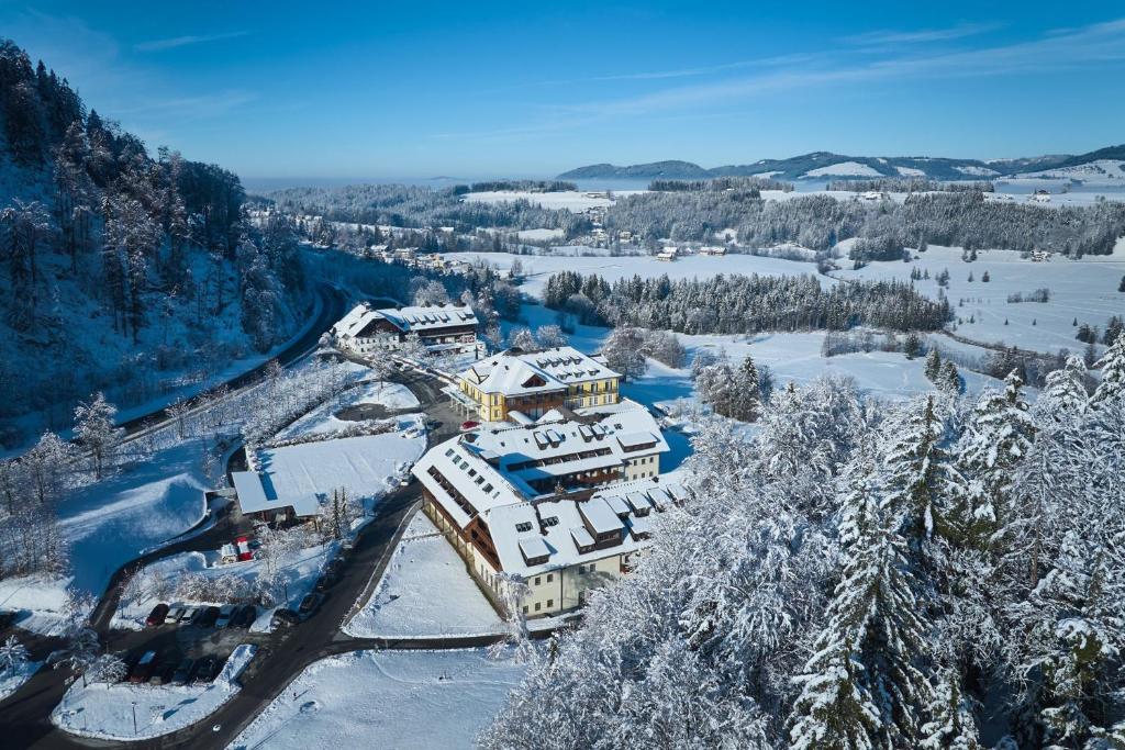 an aerial view of a resort in the snow at Arabella Jagdhof Resort am Fuschlsee, a Tribute Portfolio Hotel in Hof bei Salzburg