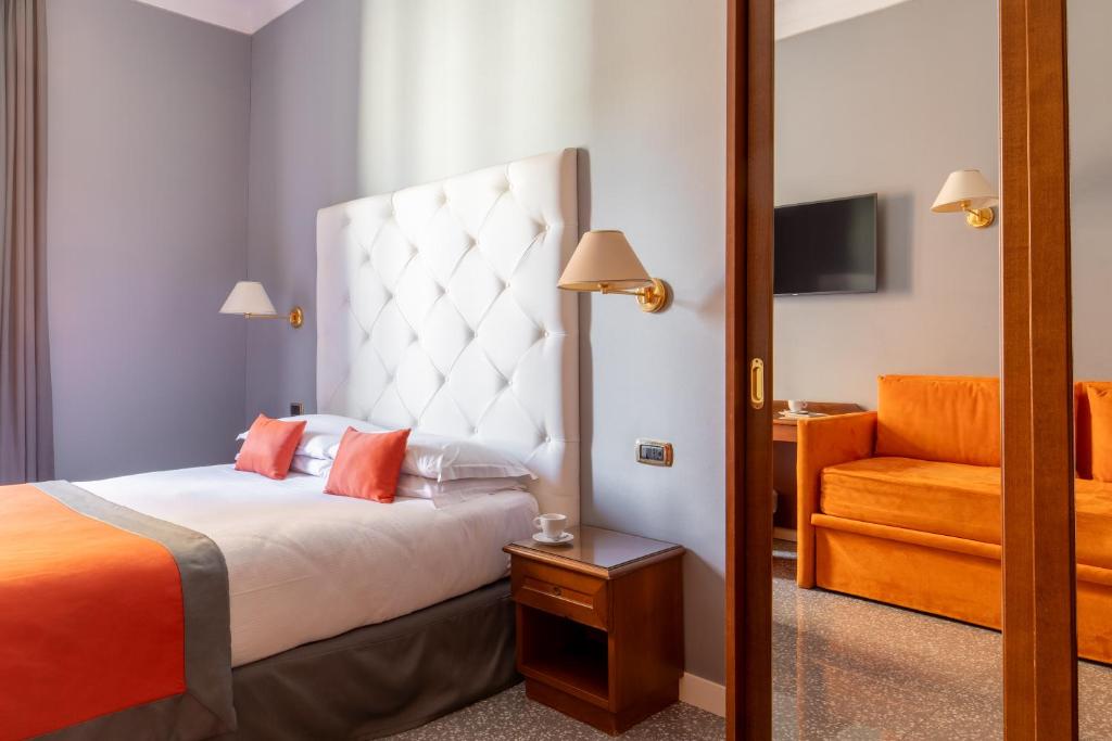 Postel nebo postele na pokoji v ubytování Hotel Montecarlo