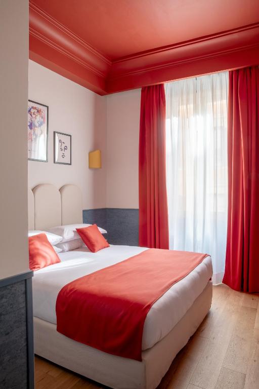 Postel nebo postele na pokoji v ubytování Hotel Montecarlo