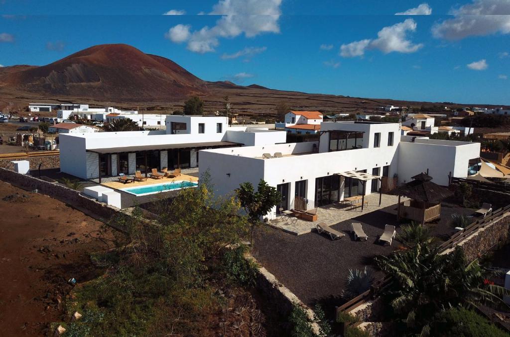 an aerial view of a white house in a desert at NaoClub Fuerteventura in Lajares