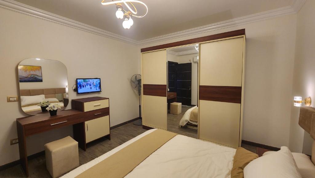 Postel nebo postele na pokoji v ubytování Madinaty apartment 1 شقة فندقية مفروشة سوبر لوكس في مدينتي