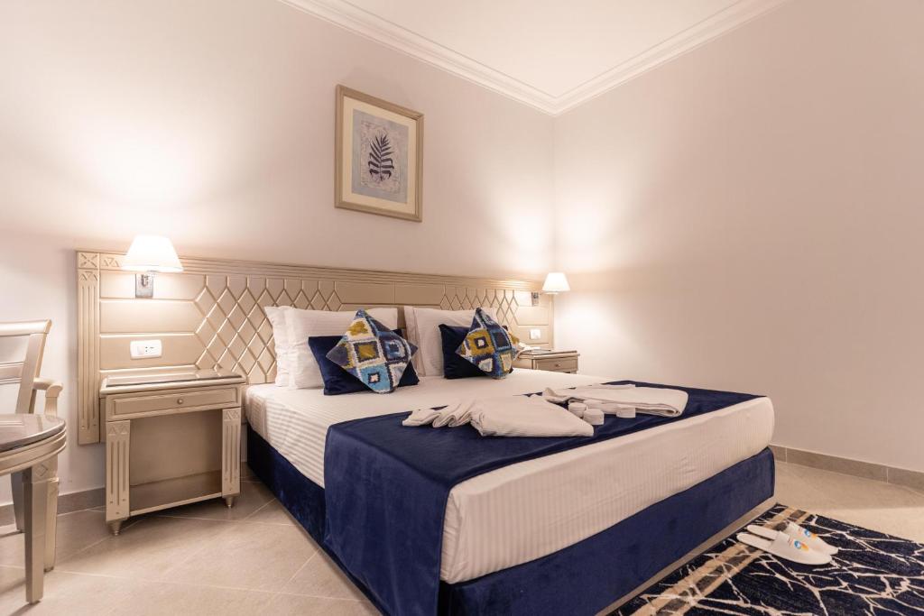 Postel nebo postele na pokoji v ubytování Malikia Resort Abu Dabbab