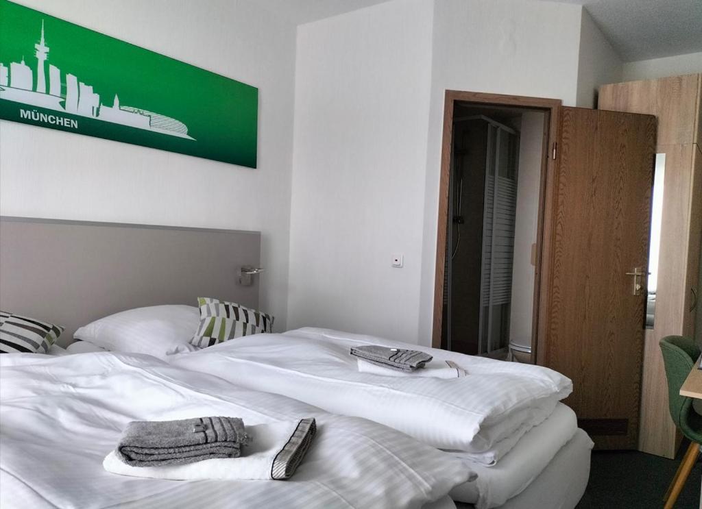Postel nebo postele na pokoji v ubytování Hotel Silbertanne