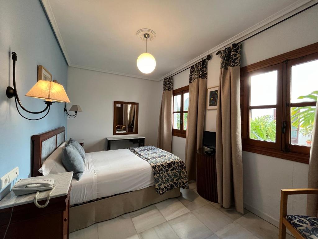 Postel nebo postele na pokoji v ubytování Hotel Maestre