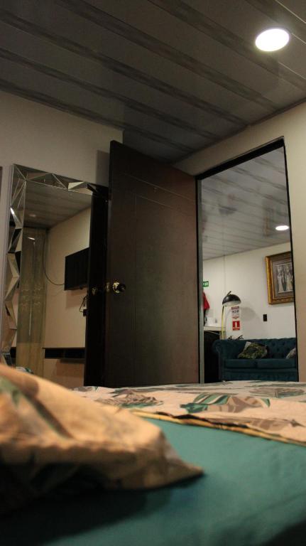 Postel nebo postele na pokoji v ubytování Hostal Queens Deluxe