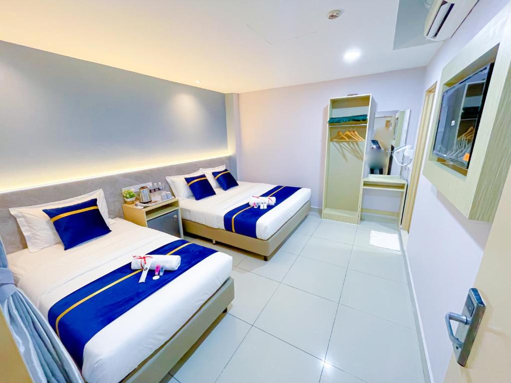 StarQ Hotel Bukit Bintangにあるベッド