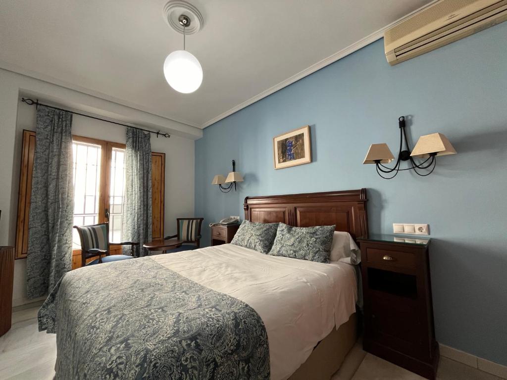 Postel nebo postele na pokoji v ubytování Hotel Maestre