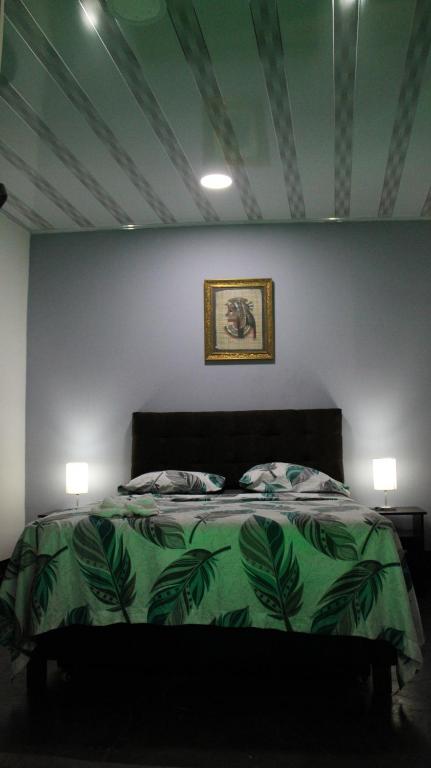 Postel nebo postele na pokoji v ubytování Hostal Queens Deluxe
