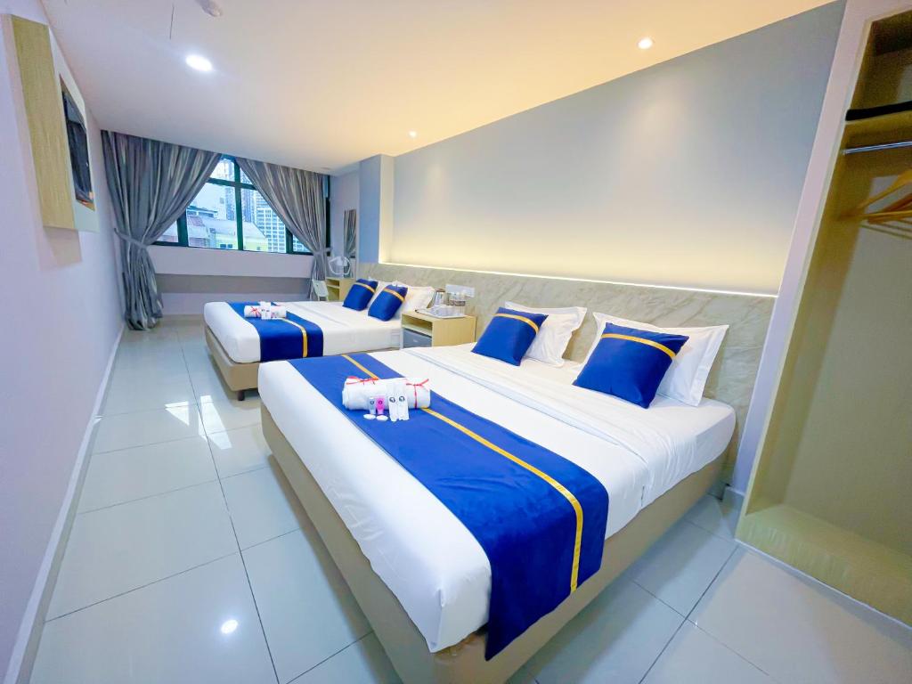 StarQ Hotel Bukit Bintangにあるベッド
