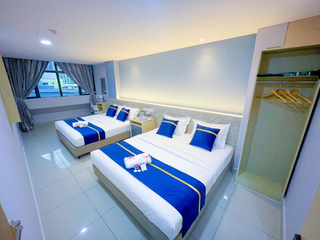StarQ Hotel Bukit Bintangにあるベッド