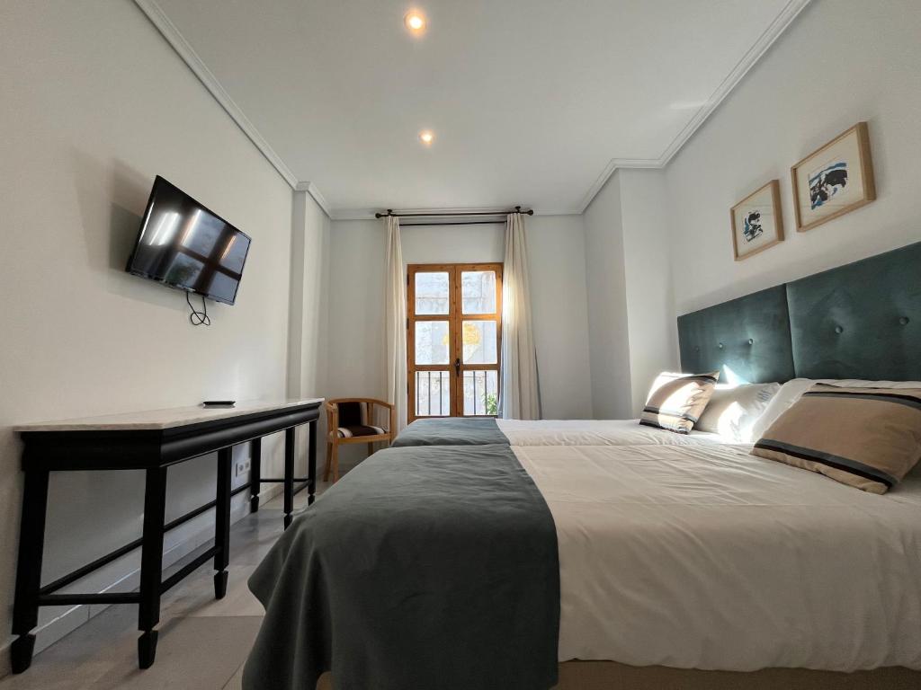 Postel nebo postele na pokoji v ubytování Hotel Maestre
