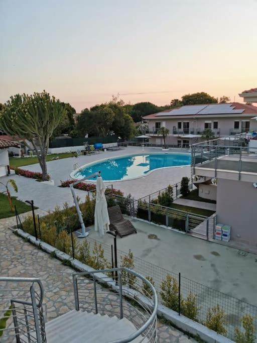 a view of a swimming pool in a resort at Zambrone Mare Appartamento / Piscina / Mare in Zambrone