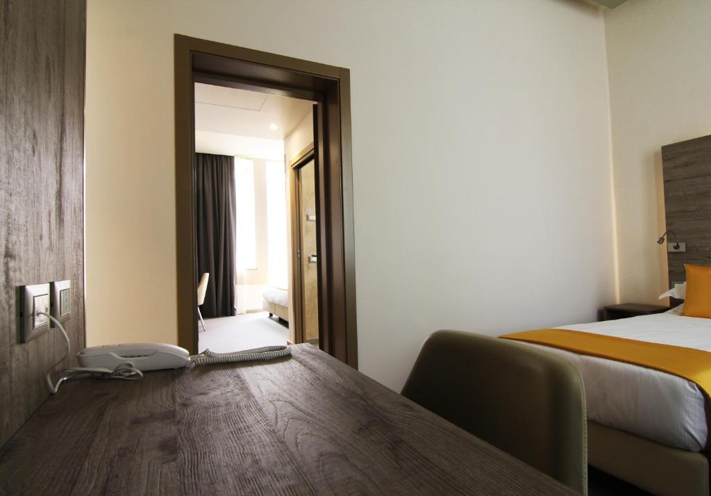 Postel nebo postele na pokoji v ubytování Sole Hotel Verona