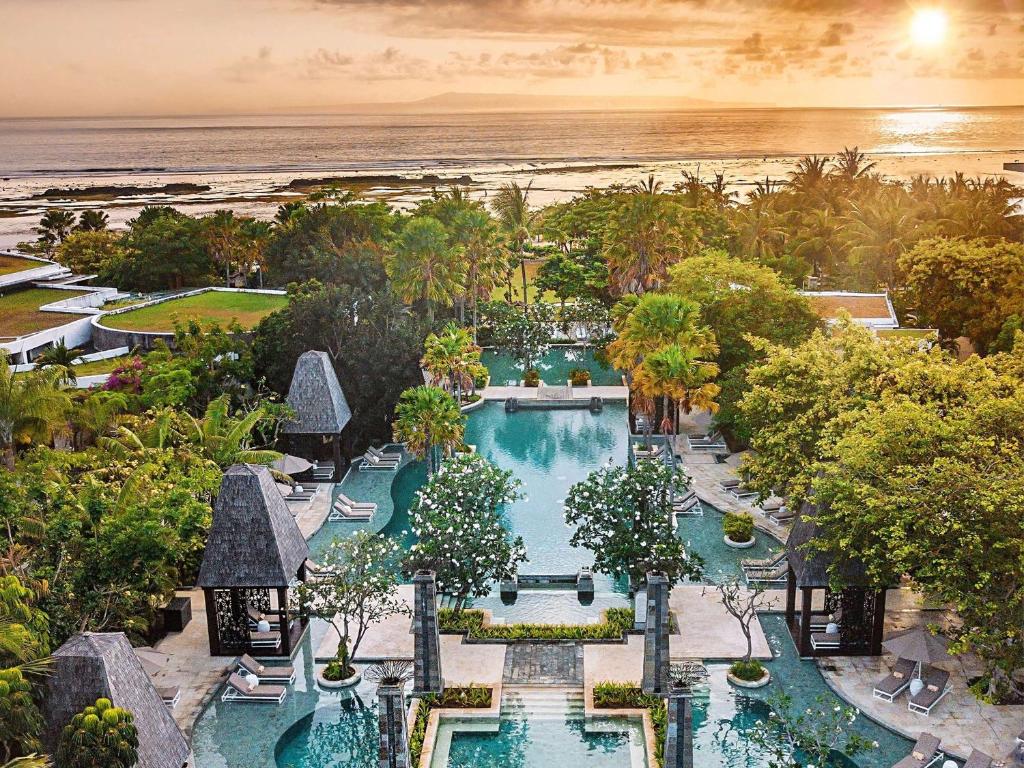 an aerial view of a resort with a swimming pool at Sofitel Bali Nusa Dua Beach Resort in Nusa Dua