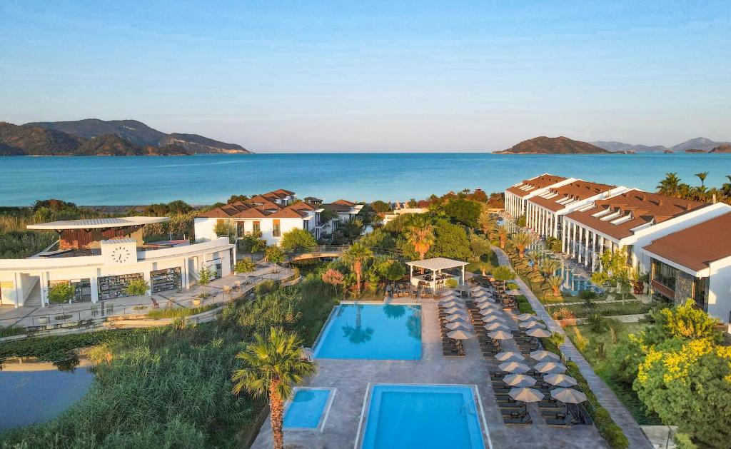 an aerial view of a resort with a swimming pool at Jiva Beach Resort - Ultra All Inclusive in Fethiye