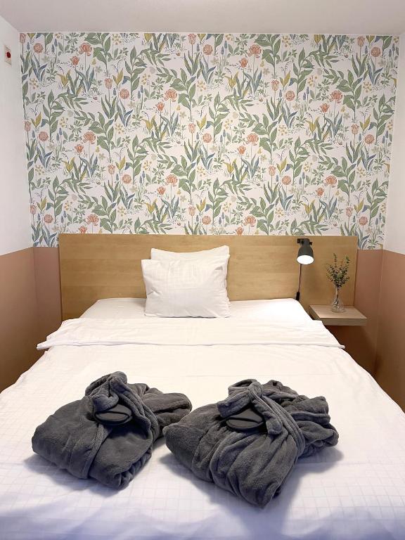 Postel nebo postele na pokoji v ubytování 2Home Hotel Apartments