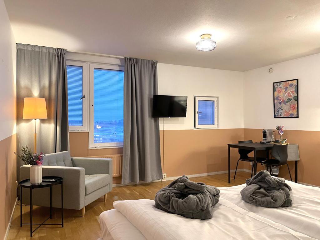 Postel nebo postele na pokoji v ubytování 2Home Hotel Apartments