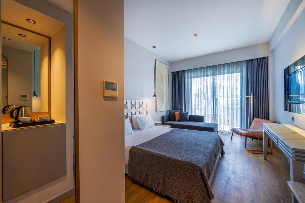 Postel nebo postele na pokoji v ubytování Jiva Beach Resort - Ultra All Inclusive