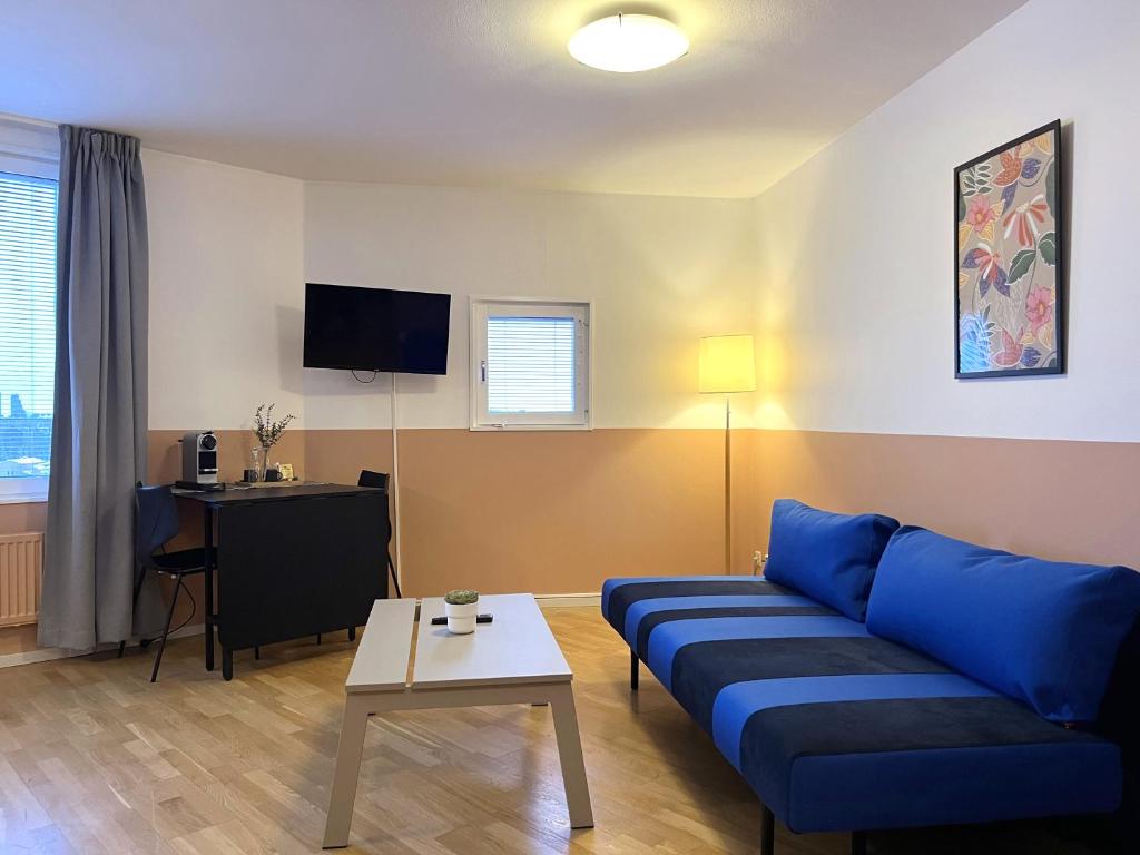 TV a/nebo společenská místnost v ubytování 2Home Hotel Apartments