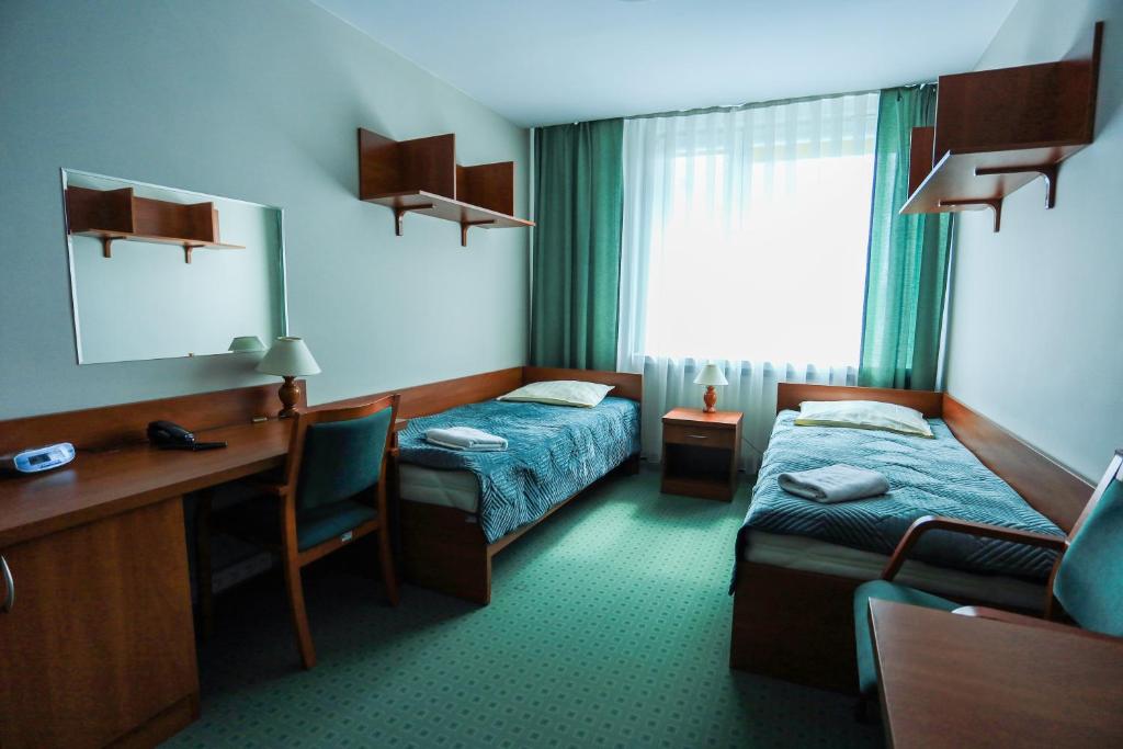 Posteľ alebo postele v izbe v ubytovaní Hotel Krakowiak