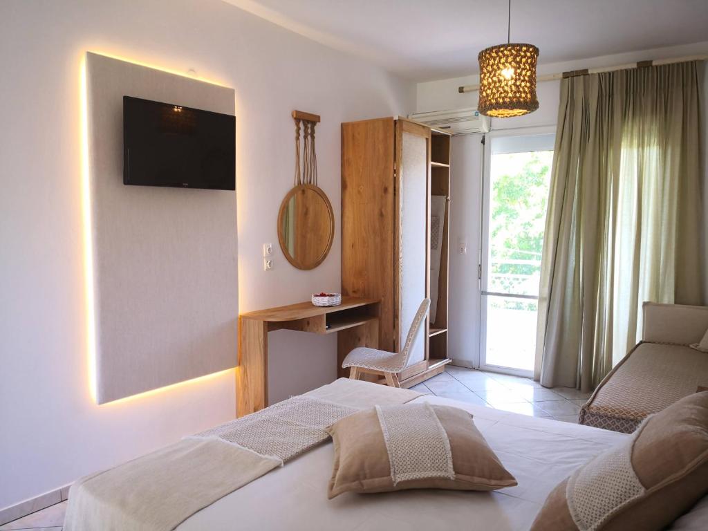 Postel nebo postele na pokoji v ubytování Porto Thassos Apartments & Studios