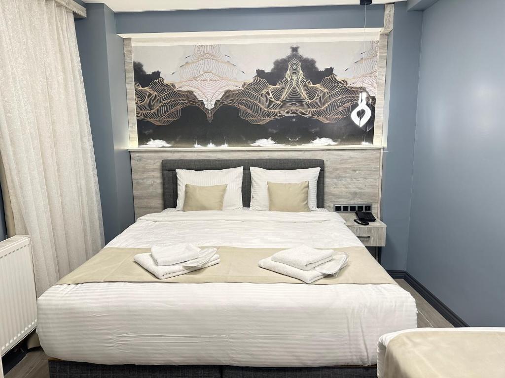 Ένα ή περισσότερα κρεβάτια σε δωμάτιο στο Blue Moonrise Hotel