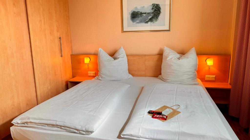 Hotel Rhein-Ruhr Bottropにあるベッド