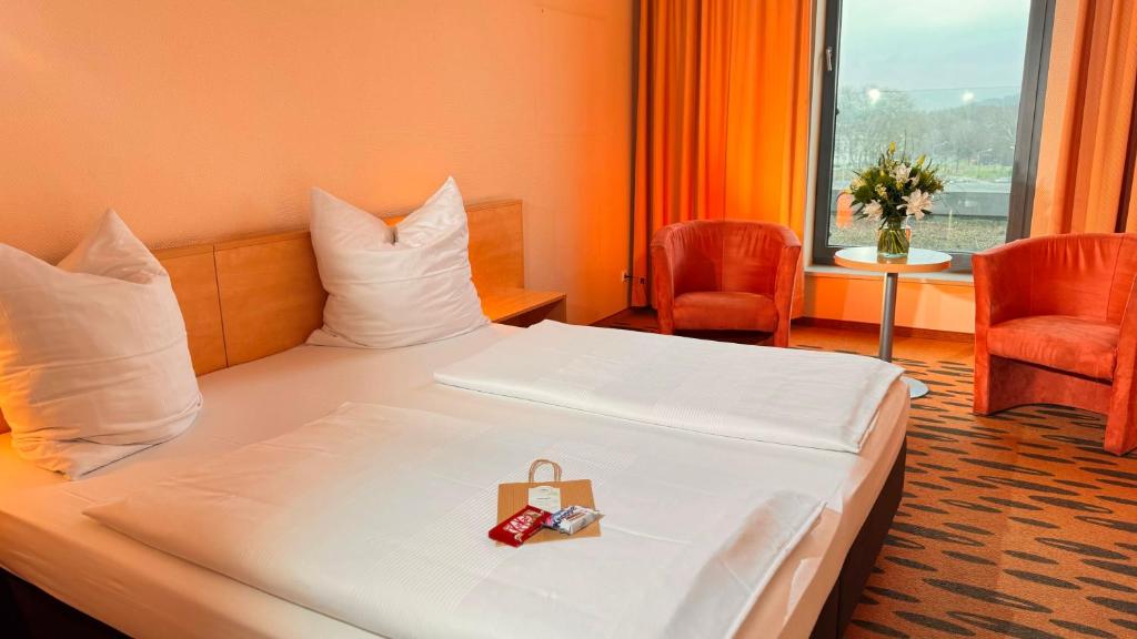Hotel Rhein-Ruhr Bottropにあるベッド