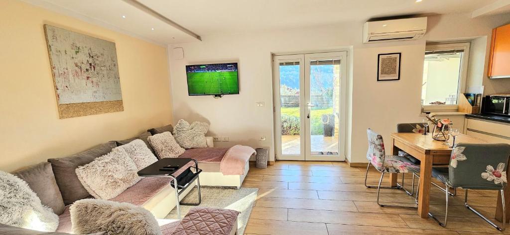 a living room with a couch and a table at Istrian Lux Residence in Koper