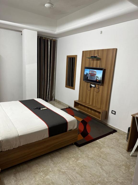 Postel nebo postele na pokoji v ubytování Gulnaar Inn