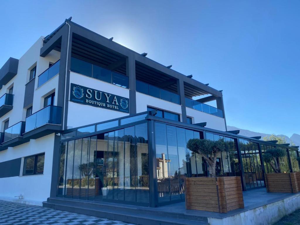 a large building with glass windows in front of it at Suya Boutique in Kyrenia