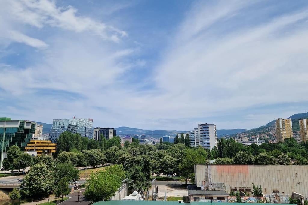 a view of a city with buildings and trees at Apartman Cowabunga in Sarajevo