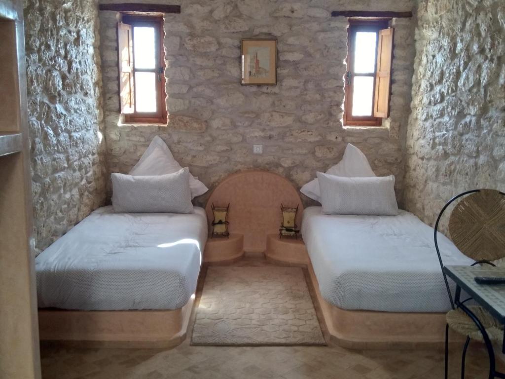 Postel nebo postele na pokoji v ubytování Riad Mamy Wababi