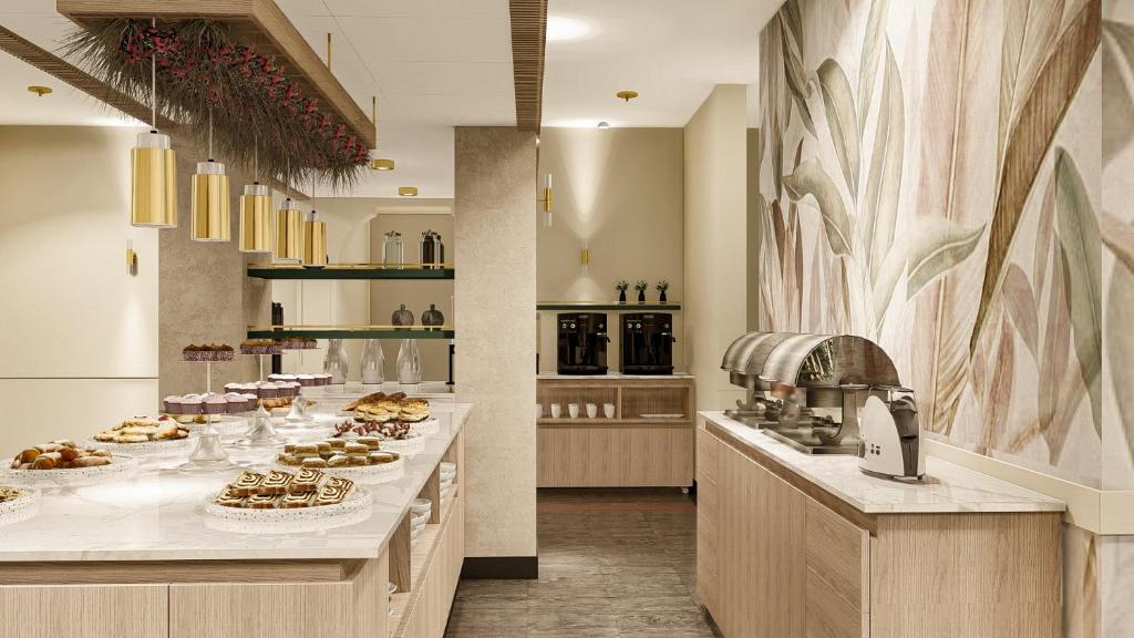a kitchen with a long counter with food on it at Massimi City Garden in Rome