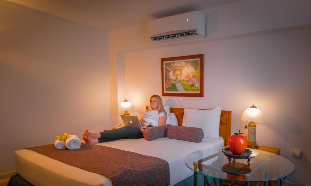Postel nebo postele na pokoji v ubytování Hotel Chicala