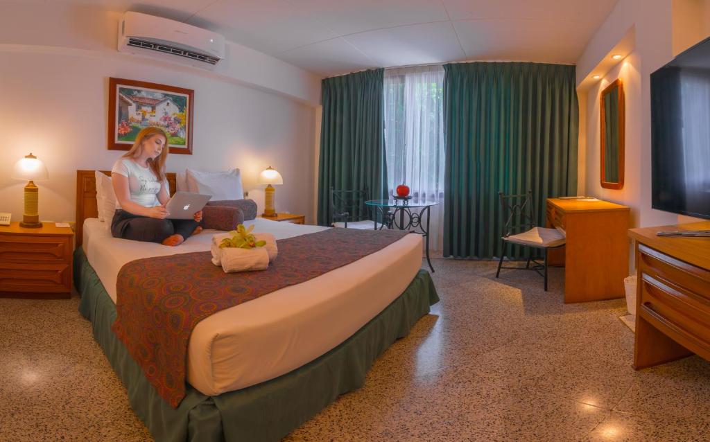 Postel nebo postele na pokoji v ubytování Hotel Chicala