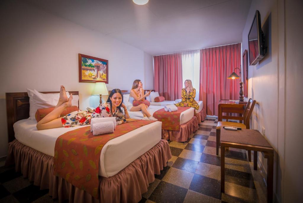 Postel nebo postele na pokoji v ubytování Hotel Chicala