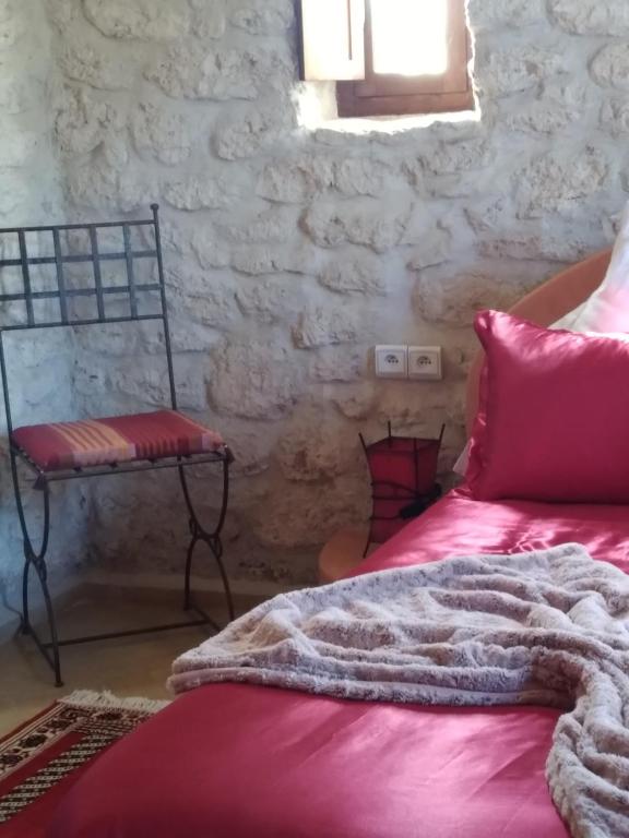 Postel nebo postele na pokoji v ubytování Riad Mamy Wababi