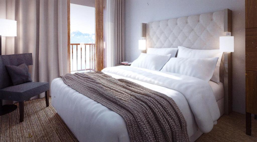 Кровать или кровати в номере Appart'Hotel Prestige Odalys Eden