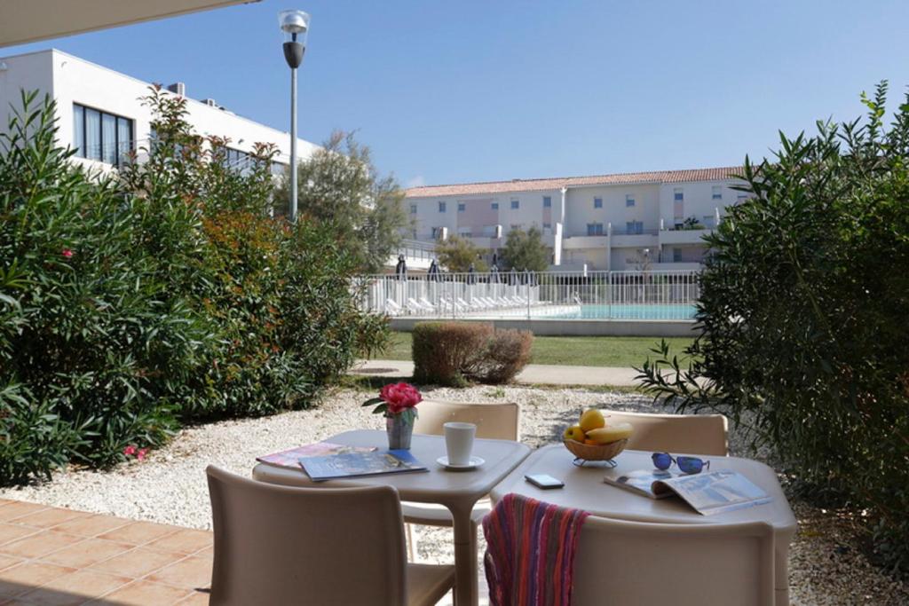 Bazén v ubytování Vacancéole - Résidence Cap Camargue nebo v jeho okolí