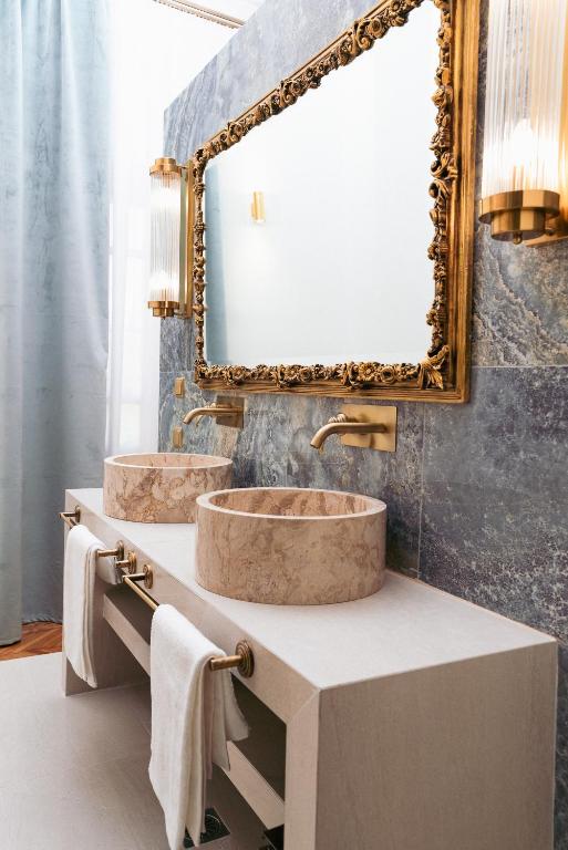 a bathroom with two sinks and a large mirror at Villa Clio, a Luxury Collection in Thessaloniki
