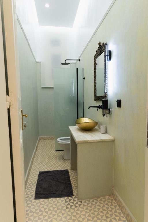 a bathroom with a sink and a toilet at Villa Clio, a Luxury Collection in Thessaloniki