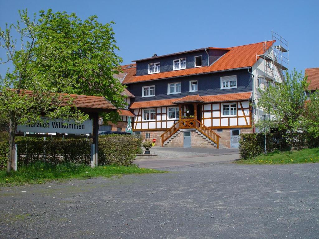 a large building with a sign in front of it at Gasthaus Debelius Beltershausen in Marburg an der Lahn